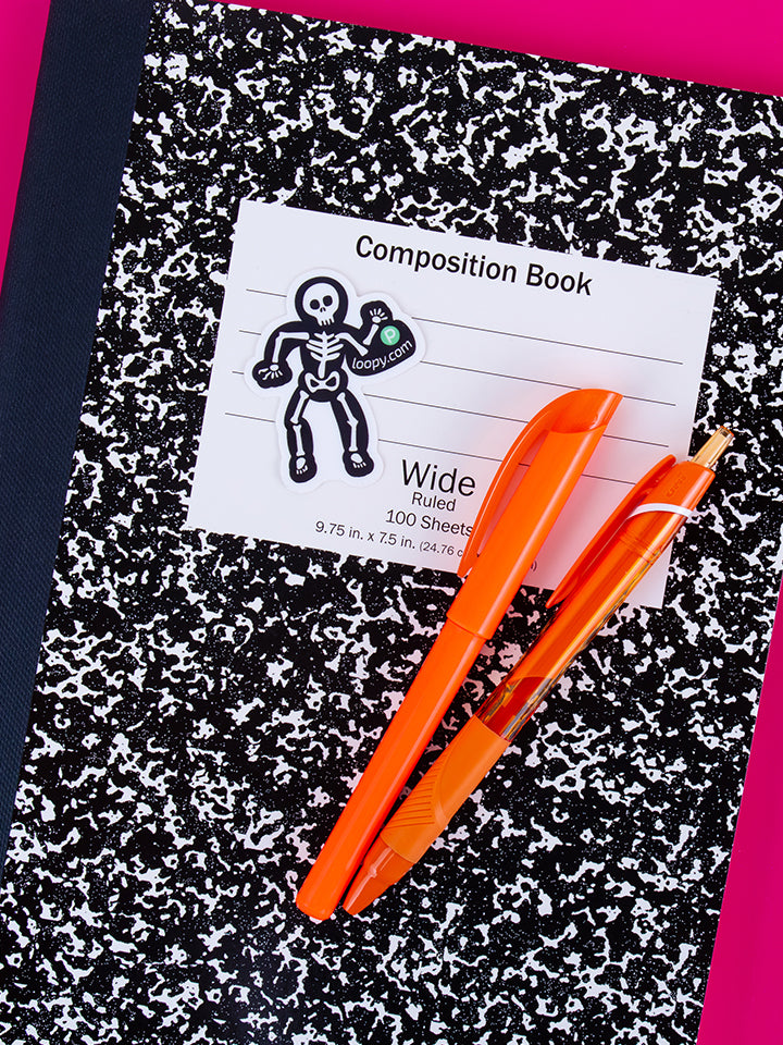 A sticker from the Loopy Cases Halloween Sticker Pack on a notebook. || feature-media