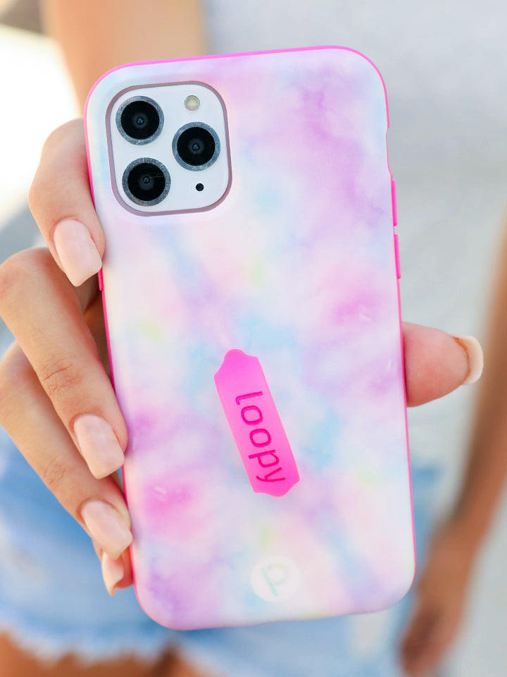 A woman holding a Tie Dye Loopy Case. || feature-media