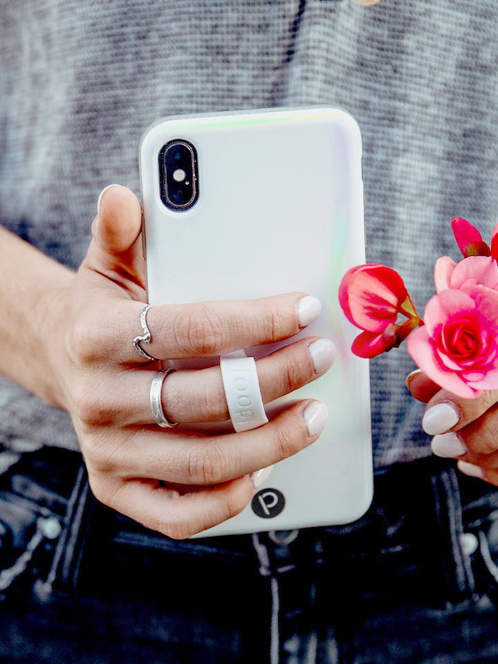 A woman holding an Opal Loopy Case. || feature-media