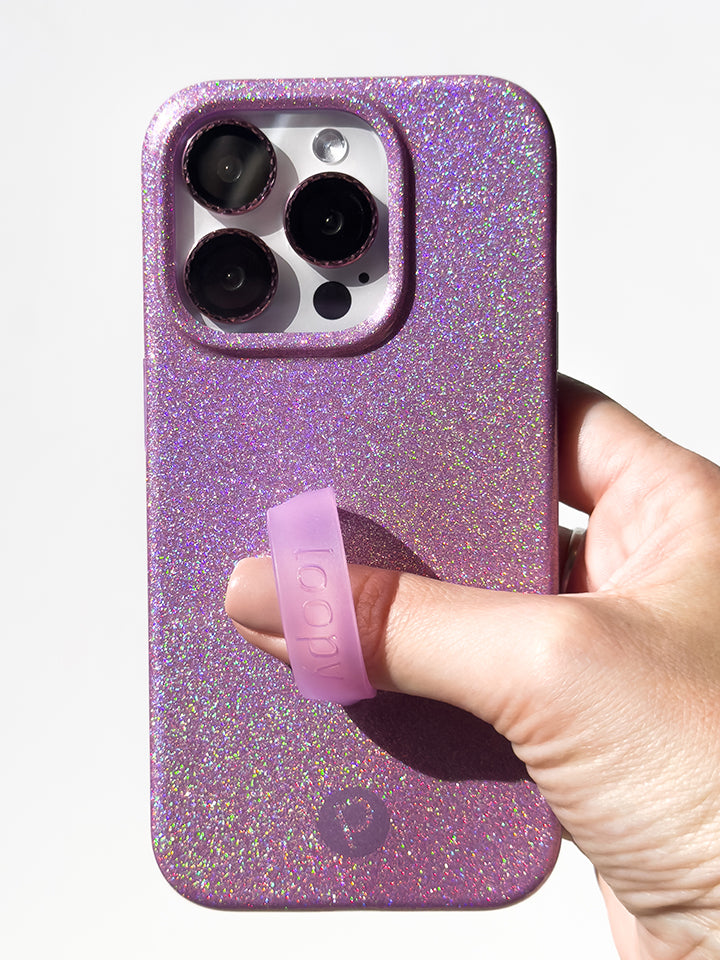 A woman holding a Lavender Sparkle Loopy Case. || feature-media