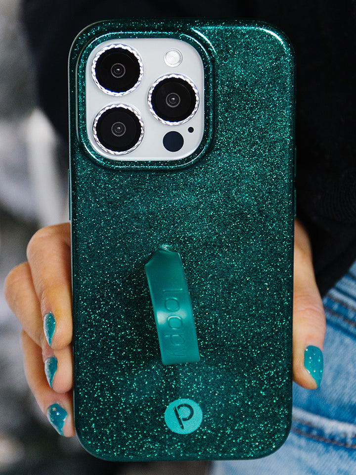 A woman holding an Emerald Sparkle Loopy Case.|| feature-media