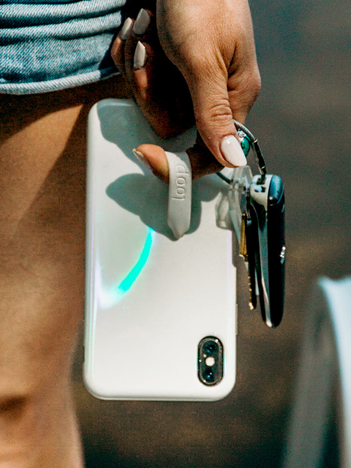 A woman holding an Opal Loopy Case. || feature-media