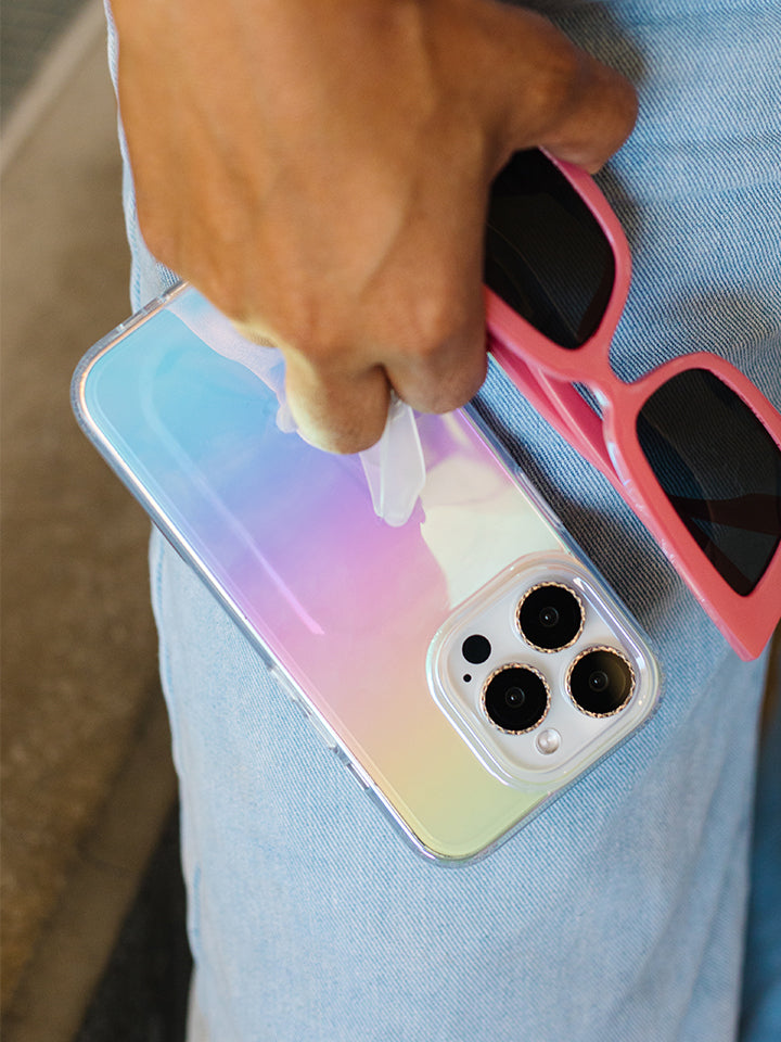 A woman holding a Clear Opal Loopy Case. || feature-media